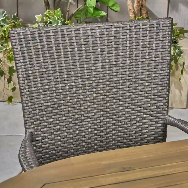 Elderon Outdoor 7 Piece Acacia Wood Dining Set with Stacking Wicker Chairs by Christopher Knight Home